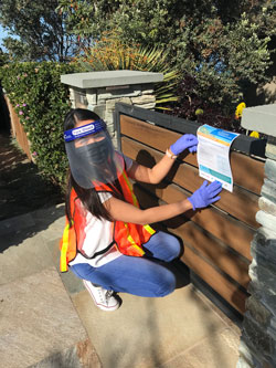 person doing outreach in PPE gear